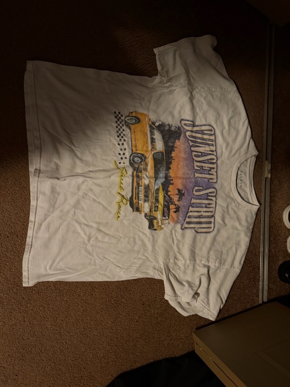 PacSun White Graphic Tee with Yellow Car and Purple Text